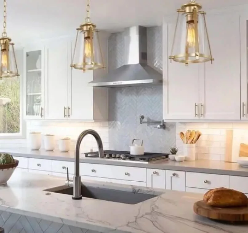 luxurious kitchen with stunning golden pendant lights