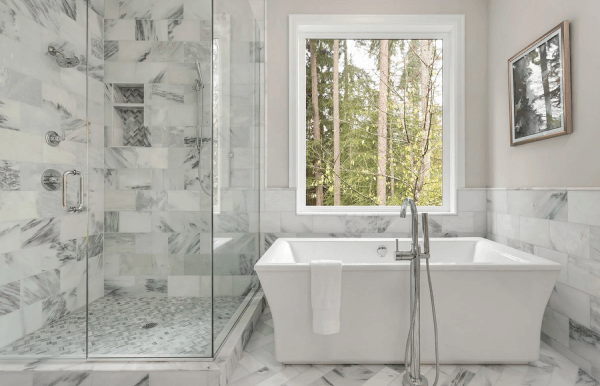 premium bathroom with glass door shower and stunning white marble tiles