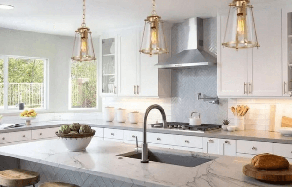 luxurious kitchen with stunning golden pendant lights