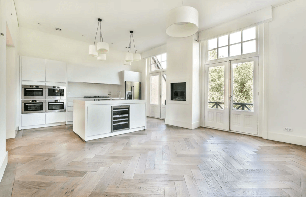 white thyme kitchen with wooden flooring