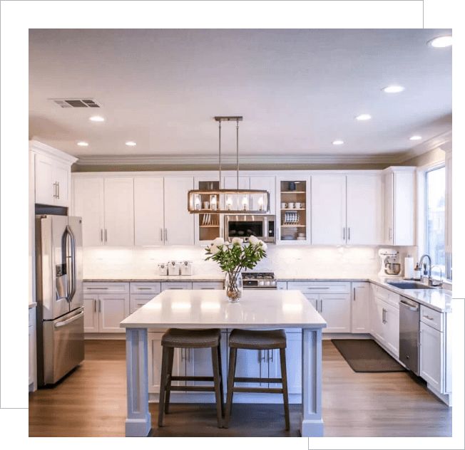 A design of kitchen with white cabinets