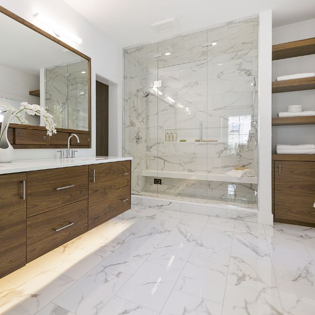 A luxurious bathroom with elegant marble flooring and sleek wood cabinets.