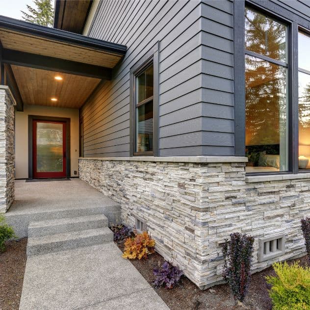 Stone siding and a stylish front door