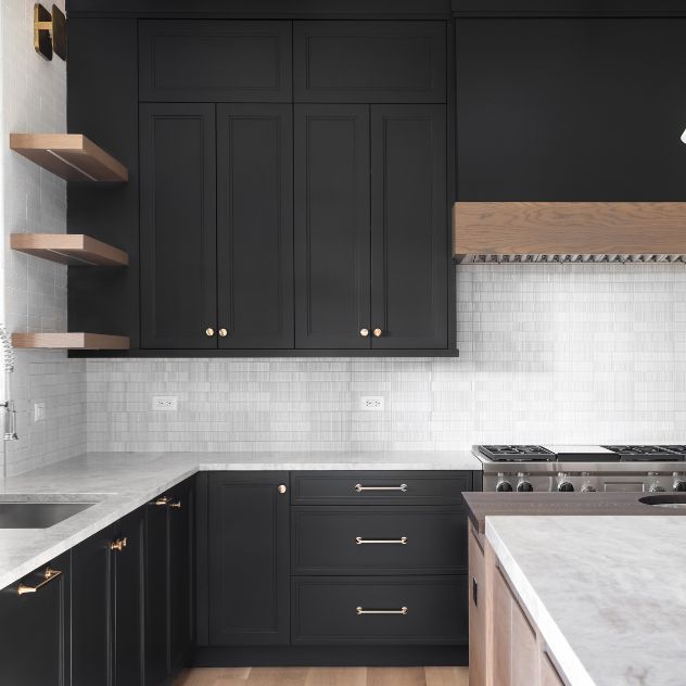 Remodeled black kitchen with white cabinets